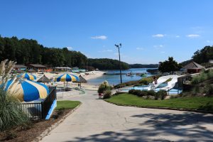 The history of Lake Lanier beaches is closely tied to the history of the lake itself. Lake Lanier was created in 1956 by the completion of Buford Dam on the Chattahoochee River. The lake was created for flood control, drinking water, and hydroelectric power.

The first beaches on Lake Lanier were created in the early 1960s. These beaches were mostly small and undeveloped. In the 1970s, the Lake Lanier Islands Development Authority (LLIDA) was formed to manage and develop the lake's recreational resources. LLIDA began to develop larger and more elaborate beaches, including the beach at Lanier Islands Resort.

In the 1980s, the Georgia Department of Natural Resources began to develop beaches on Lake Lanier. These beaches were designed to be more natural and to provide a more authentic lake experience. The department also began to develop trails and other amenities around the lake.

Today, there are over 50 beaches on Lake Lanier. These beaches range from small and secluded to large and developed. There are also many beaches that are accessible only by boat. No matter what type of beach experience you are looking for, you are sure to find it on Lake Lanier.